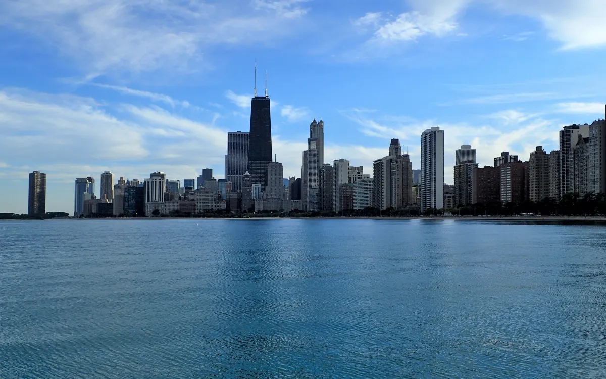 Chicago’s skyline along the lakefront beneath a blue sky