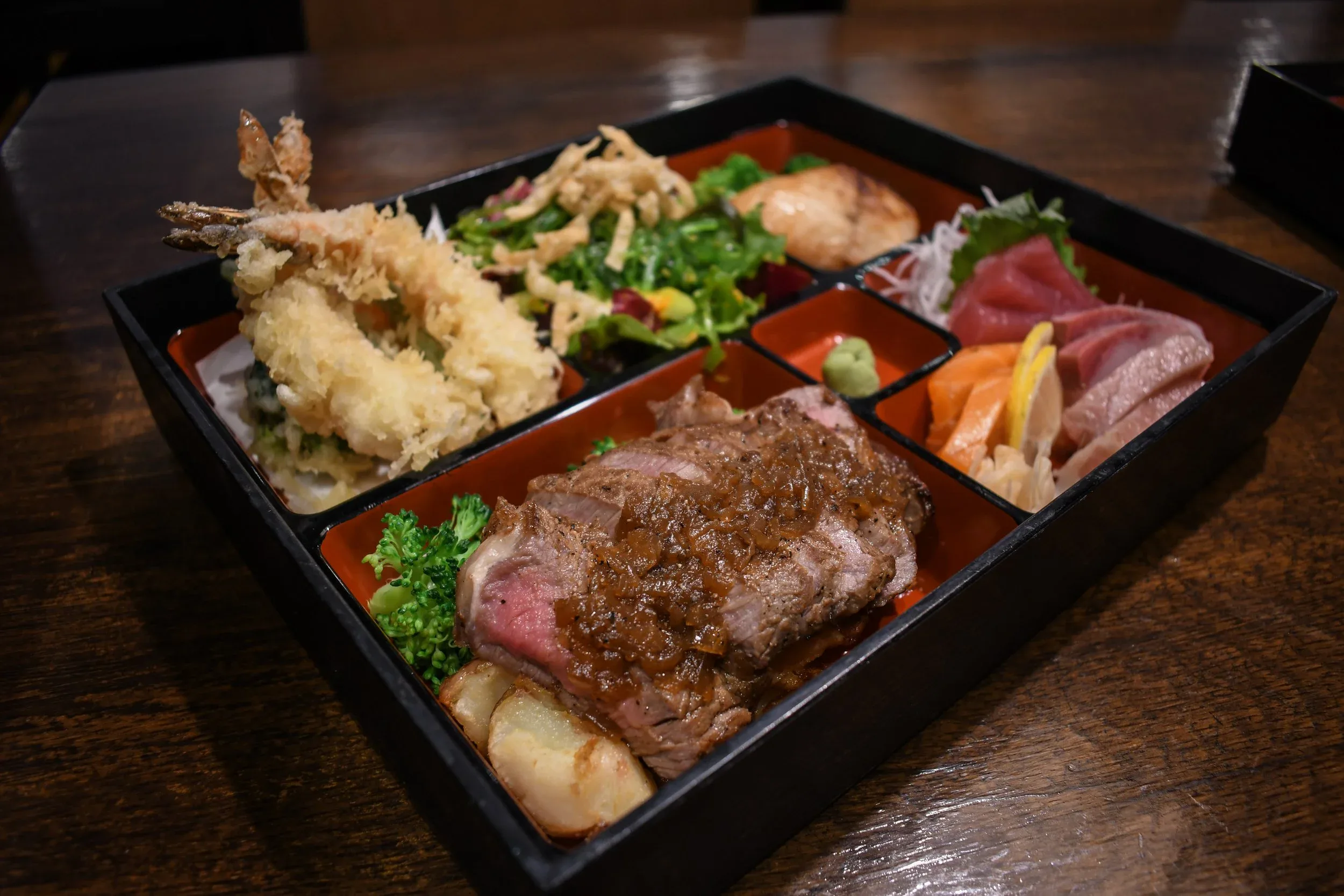 A deluxe bento with tempura and sashimi at Rakuya